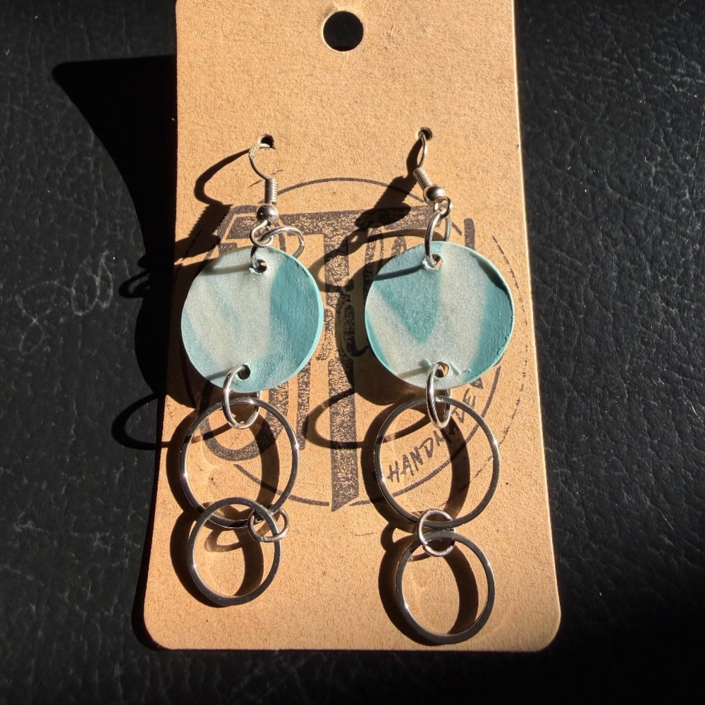 Spilled T handmade earrings double silver circle and blue color